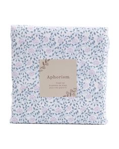 the blue and white floral print pillow with an ad for aphrismm on it