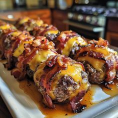 bacon wrapped in cheese on a white plate