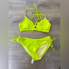 Cute Neon Green/Yellow Bikini. Tie Sides, Cross Back Top. Bnwt-Tried On Only. Size L. Neon Beachwear For Spring, Yellow Strappy Swimwear For The Beach, Yellow Strappy Swimwear For Beach, Yellow Strappy Swimwear For Vacation, Trendy Neon Yellow Swimwear For Spring, Yellow Strappy Summer Swimwear, Yellow Strappy Swimwear For Poolside, Neon Yellow Stretch Swimwear For Spring, Neon Yellow Swimwear For Spring Poolside