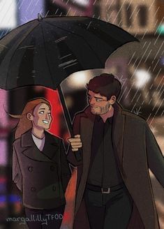 two people walking under an umbrella in the rain