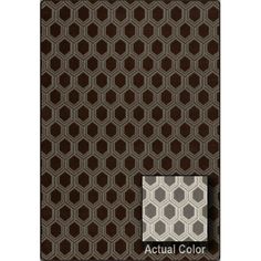 an area rug with brown and white geometric designs on it, along with the words actual color