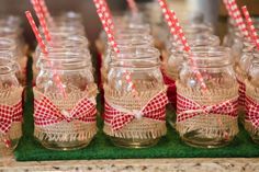 there are many mason jars with straws in them