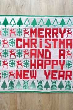 a cross stitch christmas card with the words merry christmas and happy new year