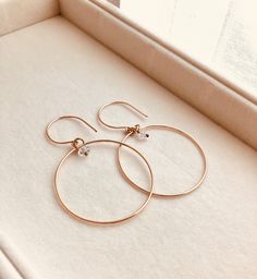 Just as effortless as they are simple, these hoop earrings are an essential everyday piece. Item Details: • This listing is for A PAIR ( 2 pieces ) earrings.• All metal is components are sterling silver and 14k gold-fill• Hoops measure 40mm in diameter.• Herkimer quartz crystals prized, each Herkimer diamond is a natural entity and no stone is identical.• The order will arrive in a gift-wrapped box and free polishing cloth. It will be ready for gift giving. All our work is custom-made by hand in Delicate Everyday Hoop Jewelry, Modern Rose Gold Hoop Earrings For Everyday Wear, Everyday Simple 14k Gold Jewelry, Everyday Round Huggie Earrings In Recycled Gold, Dainty Hoop Jewelry For Everyday, Simple 14k Rose Gold Filled Jewelry, Simple Rose Gold 14k Gold-filled Jewelry, Delicate Tarnish Resistant Hoop Earrings For Everyday, Everyday Hoop Jewelry In Recycled Gold