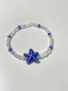 This will come with the pattern and color beads in the picture, and a blue starfish.                                                  * NOTE:*                         The bracelet in the picture is 6.5 inches.                         If you pick a different size the pattern           of beads in the back will be slightly different.  ANY QUESTIONS AT ALL OR CUSTOM ORDERS PLEASE DON'T HESITATE TO MESSAGE ME I WILL GET BACK TO YOU ASAP! -Please roll-on bracelets to avoid   over-stretching. -As with Cheap Ocean-inspired Beaded Bracelets For Gift, Cheap Ocean-inspired Beaded Bracelet, Cheap Blue Bracelets With Starfish Charm, Blue Star Jewelry For Vacation, Blue Star Shaped Jewelry For Vacation, Adjustable Blue Starfish Jewelry, Adjustable Blue Bracelets With Starfish Charm, Blue Bracelet With Starfish Charm And Round Beads, Blue Bracelets With Starfish Charm And Round Beads