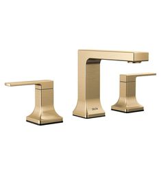 a gold faucet with two handles