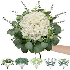 a bouquet of white roses and greenery on display