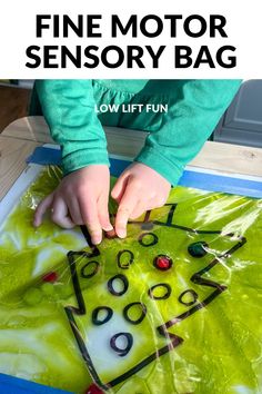 a child making a christmas tree with the words fine motor sensory bag on it