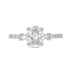 A stunning classic, this diamond engagement ring sets the stage for your happily ever after. Fashioned in platinum, this design showcases a 1 ct. certified oval-shaped diamond boasting a color rank of I and clarity of Si2. Tapered baguette-cut diamonds punctuate the diamond-lined shank. Captivating with 1-1/5 cts. t.w. of diamonds and a bright polished shine, this engagement ring will sparkle as long as your forever love. This style arrives with a certificate that includes a photo and a description of the diamond, which guarantees quality and can be used for insurance purposes. Oval Lab Grown Diamond Rings In White, White Oval Lab Grown Diamond Rings, Oval White Lab Grown Diamond Rings, White Oval Lab-grown Diamond Ring, Gia Certified Oval Lab Grown Diamond Ring, Gia Certified Oval Lab-grown Diamond Ring, Gia Certified Oval White Wedding Rings, White Oval Diamond Ring With Vvs Clarity, Modern White Oval Diamond Ring