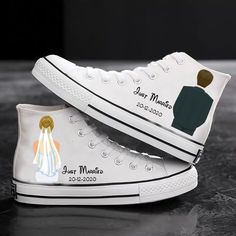 a pair of white sneakers with the bride and groom on them