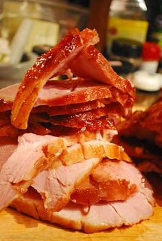 sliced ham and other meats on a cutting board