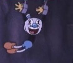 an image of a cartoon character hanging from the side of a building with its mouth open