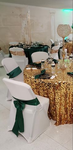 there are many chairs and tables that have green sashes on them, along with gold sequin tablecloths