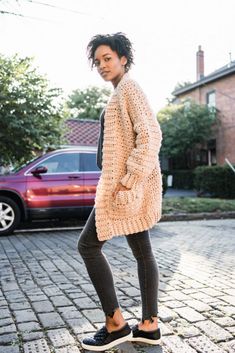 a woman standing on top of a skateboard