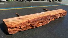 a large piece of wood sitting on top of a parking lot