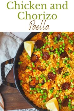 chicken and chorizzo paella in a skillet with peas