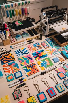 the table is covered with many different items for making paper and magnets on it