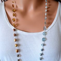 All of the shades of the beach are incorporated into this long gemstone necklace, from the darkest midnight blue to the palest tan. I used iolite, moss aquamarine, scapolite, citrine, champagne citrine, whiskey quartz and smoky quartz for the gemstones; and freshwater pearls in three shades of blue and copper. I chose the beads carefully to blend seamlessly from one colour to the next, the entire way around the necklace. This necklace brings to mind the sand, surf, water and sky, and is perfect Elegant Beach Jewelry With Gemstone Beads, Elegant Lariat Beaded Necklace For Beach, Elegant Long Necklace For Beach, Blues And Browns, Pale Tan, Pearl Beach, Moss Aquamarine, Beach Bride, Long Necklaces