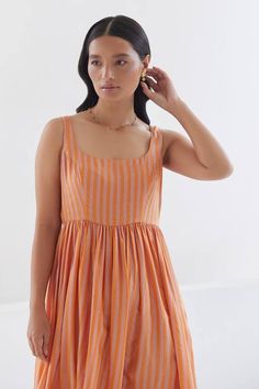 Orange, pink sleeveless dress with stripe woven motifs and gathered waist. - Aza Fashions Summer Sleeveless Dress With Gathered Neckline, Sleeveless Summer Dresses With Gathered Neckline, Sleeveless Cotton Maxi Dress With Gathered Waist, Pink Sleeveless Dress With Gathered Waist, Summer Midi Dress With Gathered Waist Sleeveless, Summer Midi Dress With Gathered Waist, Sleeveless Pink Dress With Gathered Waist, Sleeveless Cotton Dress With Gathered Waist, Sundress With Gathered Waist