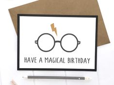 a card with the words have a magical birthday on it and a pair of glasses