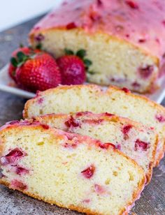 slices of strawberry pound cake with fresh strawberries on the plate next to one slice