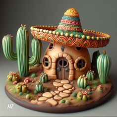 a clay house with cactus and cacti in the front, on top of it