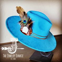 If you’re looking for the perfect accessory to complement your favorite boho style, look no further. The Boho-Style Western Felt Hat w/r Hat Band Accent by The Jewelry Junkie is absolutely everything that you need. Not only is it easy to incorporate into any and all outfits, but the genuine leather of the band immediately elevates whatever it is you’re wearing. The item that you receive in the mail will resemble the one in the picture but, because every piece by Jewelry Junkie is handmade, it wi Hat Bands, Large Feathers, Western Hat, Hat Fits, Leather Hat, Fedora Hats, Feather Hat, Ecommerce Website Design, Gold Feathers