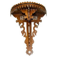 an ornate wooden clock with intricate carvings on it