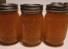 three mason jars sitting on top of a counter