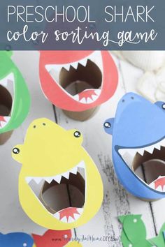 an assortment of colorful shark cupcakes with the words preschool shark color sorting game