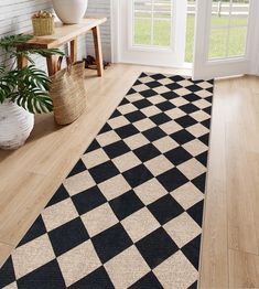 a black and white checkered rug in a room