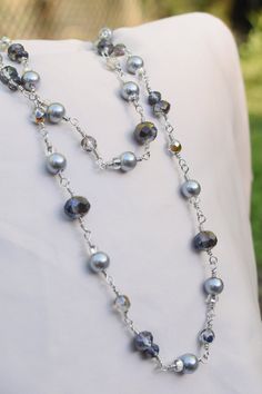 This 35.5 inch length necklace features a mix of grey glass pearl beads and Czech crystal grey beads. It is rosary style with twisted metal with beads. This is stunning and elegant. Can be worn dressy or casual. Elegant Gray Necklace With Faceted Beads, Elegant Gray Faceted Beads Necklace, Twisted Metal, Grey Beads, Rosary Necklace, Czech Crystal, Grey Glass, Rosary, Pearl Beads