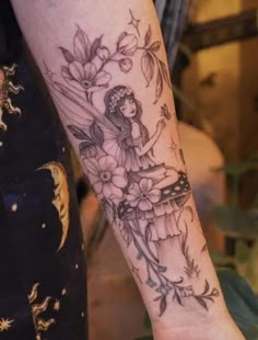 a woman with a flower tattoo on her arm