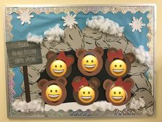 a group of teddy bears with faces painted on them, standing in front of a snow covered mountain