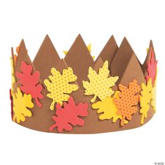 a paper crown with fall leaves on it