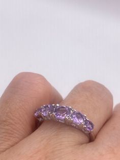 Unusual genuine Amethyst band ring  Sterling silver setting handmade  size 9 can be re sized for you for a $20 jeweler's Fee Sterling Silver is rhodium finished to prevent tarnish All rings are shipped free in the US in a nice gift box.   Check out our over a THOUSAND great reviews Engraving is $4 per letter and is not always perfect depending on the piece. It can take a few days if the jeweler is busy. This is payable to Paypal Judithsltd@gmail.com Amethyst Rings With Vs Clarity, Round Amethyst Ring With Vs Clarity For Anniversary, Amethyst Ring With Vs Clarity For Anniversary, Purple Amethyst Ring, Amethyst Gem, Purple Band, Vintage Purple, Multi Stone Ring, Amethyst Ring