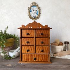 Add old-world charm and functional storage to your home with this late 19th-century antique wooden apothecary spice cabinet! Ideal for organizing spices, jewelry, or small essentials, it features sturdy wood construction with a gorgeous grain and rich patina. Recently cleaned and carefully rehydrated with food-grade natural wood oil, it's ready for use. Versatile design allows for wall mounting with a round hook or use as a tabletop piece.  See photos for detailed dimensions and scale. *Only the Organizing Spices, Victorian Cottagecore, Cottagecore Farmhouse, Spice Cabinet, Spice Organization, Rustic Kitchen Decor, Wood Oil, Cabinets Organization, Functional Storage