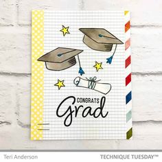 congratulations card with graduation caps and diplomas on it in front of a brick wall