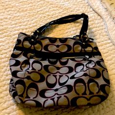 Coach Bag That I May Have Used Once Or Twice, But It Looks Brand New. It’s Made From A Black/Pink/Gray Fabric And The Inside Is Lined With A Burgundy Fabric. Its Has Been Stored In The Dust Bag And Is From A Pet Free/Smoke Free Home. I Am Moving Soon And Will Accept Reasonable Offers On Anything In My Closet. 31 Bag, Burgundy Fabric, Monogram Handbag, Gray Fabric, Black Leather Bags, Leather Hobo Bag, Coach Bag, Hobo Handbags, Vintage Coach