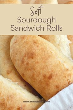 soft sourdough sandwich rolls in a basket with text overlay that reads soft sourdough sandwich rolls