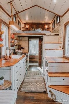 the inside of a tiny house with stairs