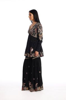 Kinfolk Black applique embellished mulberry crepe kurta, gharara with organza dupatta. From Aisha Rao's Kinfolk collection. DELIVERY TIMEPlease allow 6-8 weeks for your outfit to arrive. FABRIC DETAILSMulberry Crepe Professional cleaning only. Black Chinon Sharara For Festivals, Black Georgette Sharara With Dabka Detailing, Bohemian Semi-stitched Georgette Sharara, Semi-stitched Bohemian Sharara In Georgette, Semi-stitched Bohemian Georgette Sharara, Black Sharara With Chikankari Embroidery, Black Sharara With Mirror Work And Straight Kurta, Black Georgette Palazzo Set With Mirror Work, Black Long Sleeve Anarkali Set With Mirror Work