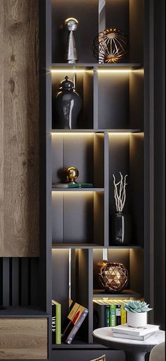 an open bookcase with many books and vases on the shelves in front of it