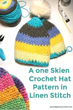 a crochet hat with yarn and scissors on the side, next to it