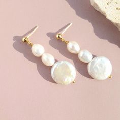 Experience timeless elegance and celebrate the art of craftsmanship in every pair. Elevate your style with jewelry that's as unique as you are. Choose these earrings to add a touch of sophistication and a dash of nature's elegance to your collection. Lightweight and versatile.  Handcrafted in USA. DETAILS: Material : 14k gold filled   Baroque Natural Pearls Dimensions:  Length 2" Note: each piece is totally handcrafted and made of natural pearls, and shapes can slightly vary ensuring no two are Baroque Pearl Earrings Gift, White Baroque Pearl Earrings For Gift, Classic Baroque Earrings As Gift, Baroque Pearl Charm Earrings, Baroque Pearl Earrings As A Gift, Handmade Pear-shaped Pearl White Earrings, Single Baroque Earring As A Gift, Baroque Pearl Dangle Bridal Earrings For Gift, Baroque Pearl Bridal Dangle Earrings For Gift