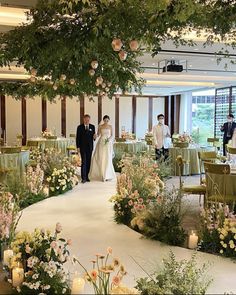 the bride and groom are walking down the aisle in their wedding ceremony at the hotel