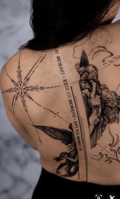 the back of a woman's shoulder with an arrow and star tattoo on it