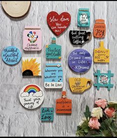 there are many magnets on the wall that say different things to be in love