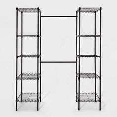 two black shelvings with wire shelves on each side and one shelf below them