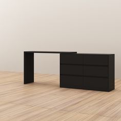 an office desk with two drawers on the bottom and one drawer at the top, in front of a white wall